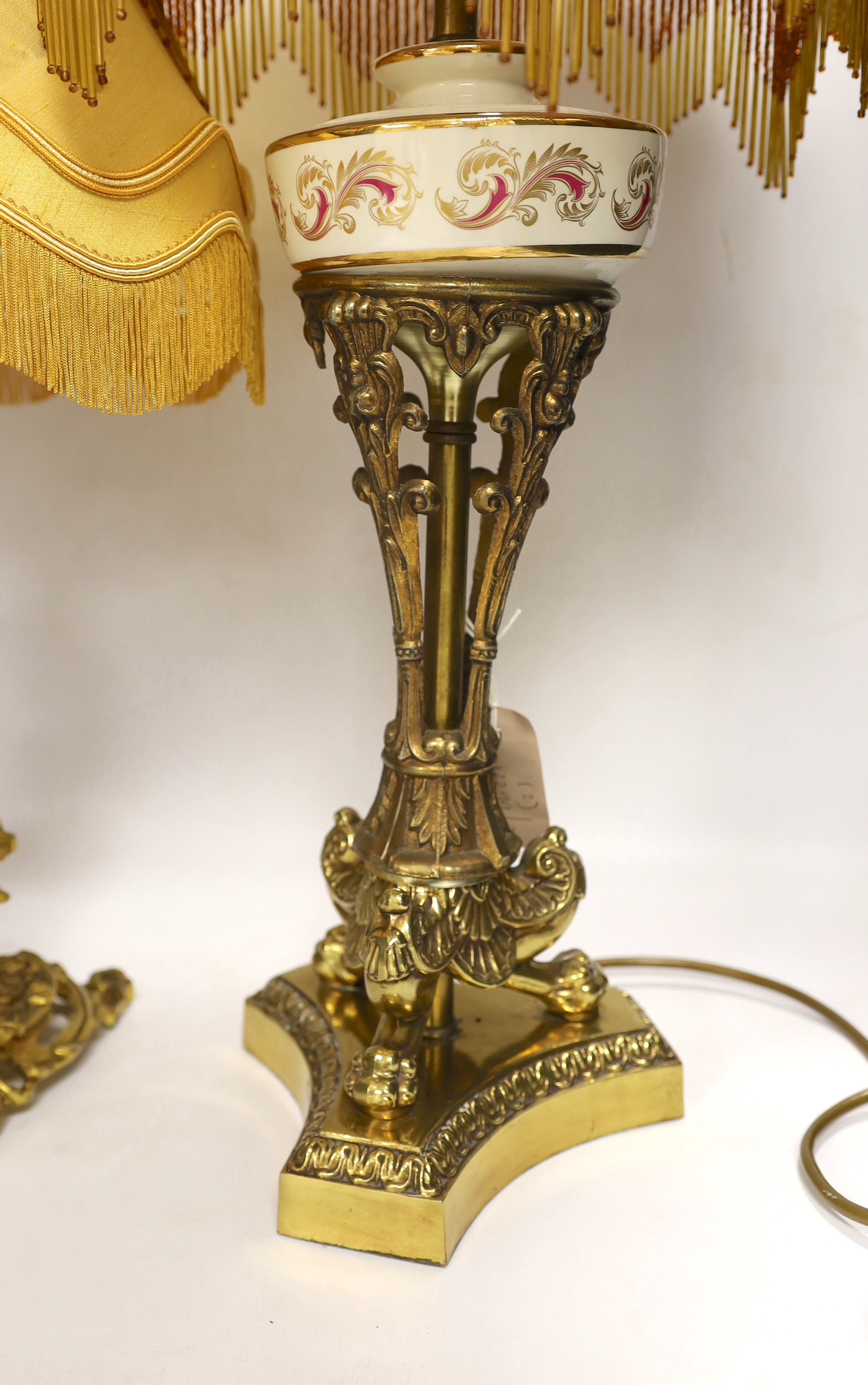 A Victorian-style brass and ceramic table lamp with beaded shade, and one other with cherub figure, tallest 62cm